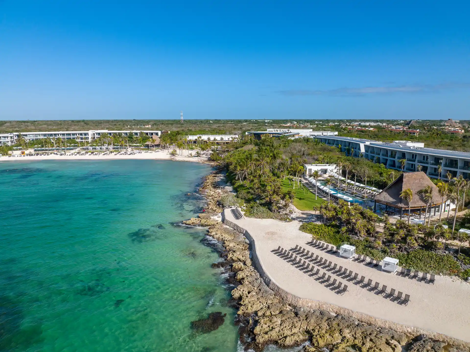 Aerial view of the pool and beach at Conrad Tulum